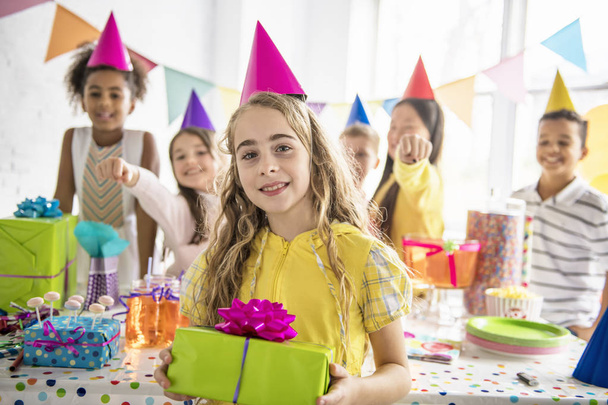 Group of adorable kids having fun at birthday party - Photo, image
