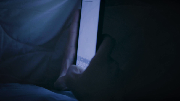 Boy under blanket with tablet - Filmati, video