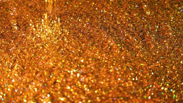 Αστραφτερή λάμψη. Χρυσή άστραφταν αδιάλειπτη βρόχο αφηρημένη κίνηση φόντο - Φωτογραφία, εικόνα