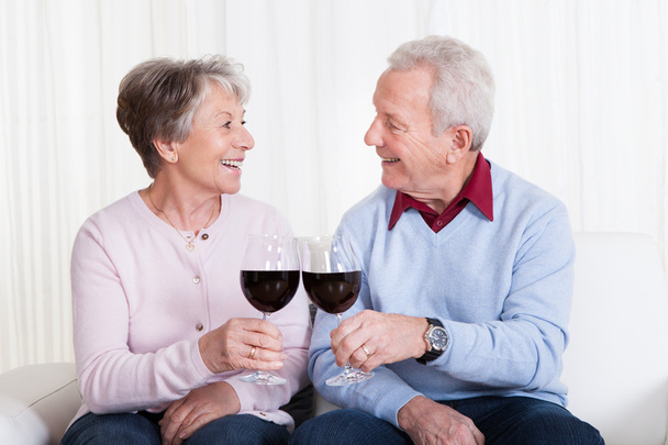Senior Couple Toasting Glass Of Wine - Photo, Image