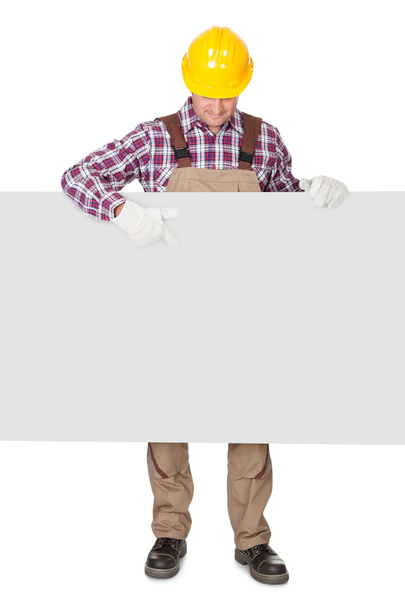 Construction worker presenting empty banner - Photo, Image