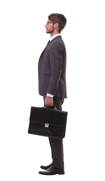 side view. confident businessman with leather briefcase - Fotó, kép