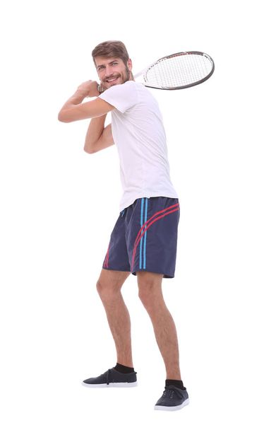 rear view. a young man with a tennis racket. - Zdjęcie, obraz