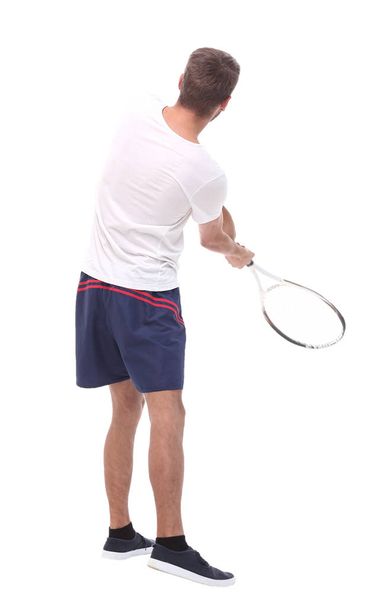 rear view. a young man with a tennis racket. - 写真・画像
