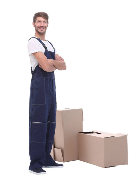 man courier standing near cardboard boxes - Фото, изображение