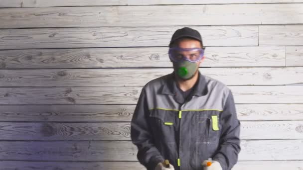 Portrait of a man with spray ready to cleaning something - Séquence, vidéo