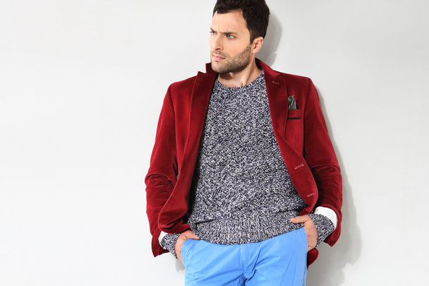 Handsome man posing in a red jacket - Fotografie, Obrázek