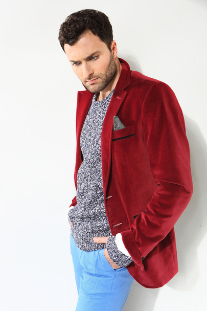 Handsome man posing in a red jacket - Foto, Imagem