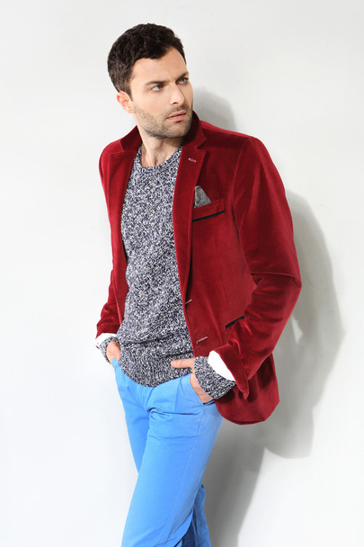Handsome man posing in a red jacket - Zdjęcie, obraz