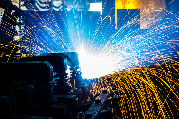 Welding robots movement in a car factory - Photo, Image