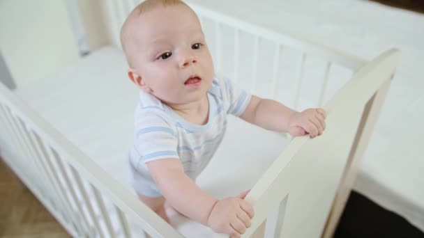 Cute Baby Playing in her Crib at Home - Filmmaterial, Video