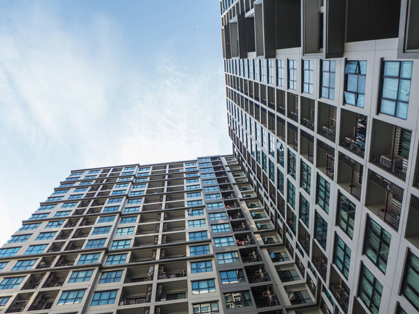 uprisen angle - building in the city on blue sky background - Zdjęcie, obraz