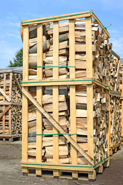 Chipped fire wood in packing on pallets - Photo, Image