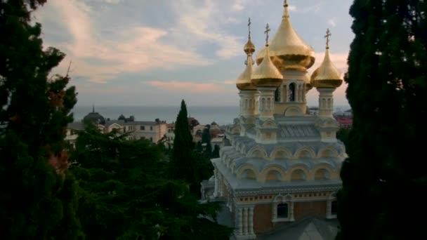Aerial view on Alexander Nevsky Orthodox church with golden domes in Yalta. Shot. Crimea. Ukraine. Ukraine, Yalta, the Alexander Nevsky orthodox church with golden domes - 映像、動画