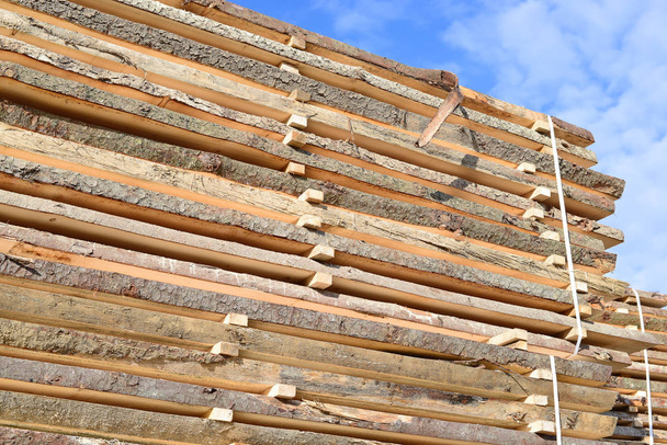 stack of wood planks stacked in the warehouse - Foto, imagen