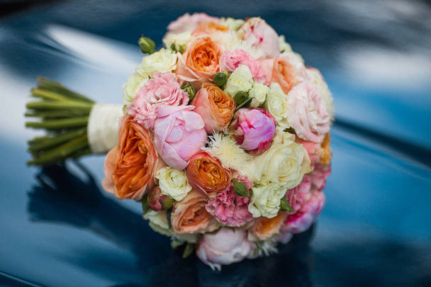 Wedding beautiful bridal bouquet of natural flowers, closeup with blurred background - Photo, Image