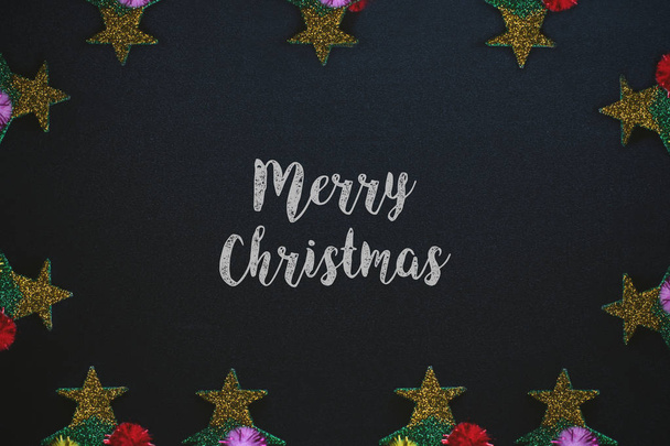 merry christmas written on chalkboard. festive holiday xmas card with stars as decoration. ideal for sending good wishes. - Photo, Image