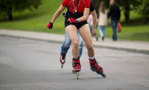woman riding on roller skates at outdoor skate park - Photo, Image