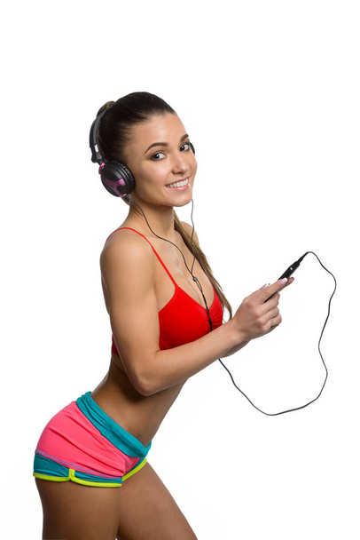Fitness girl listening to music - Foto, Imagem