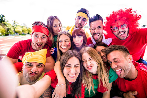 Group of football fans taking a selfie at thestadium - Fotoğraf, Görsel
