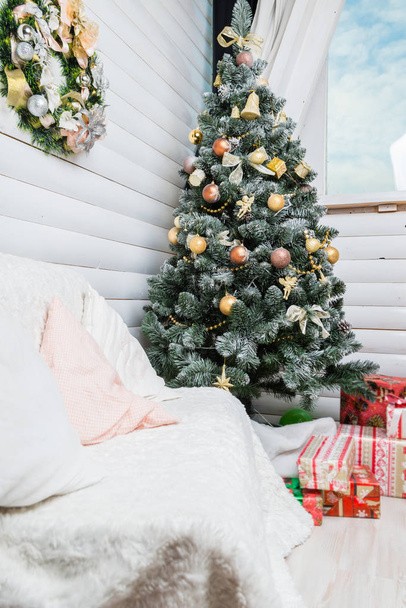 interior of the apartment decorated with Christmas decorations, the concept of Christmas readiness - 写真・画像