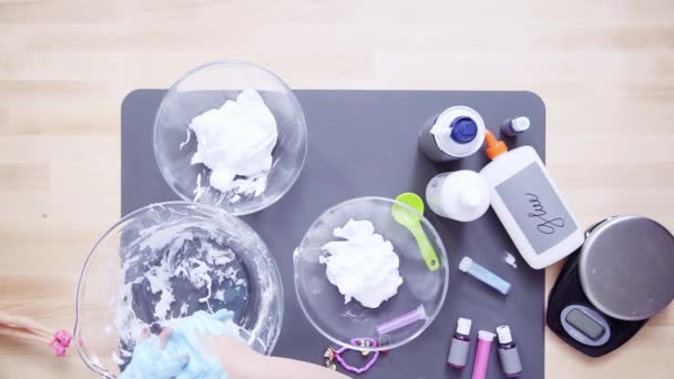 Step by step. Flat lay. Mother and daughter making colorful fluffy slime - Footage, Video