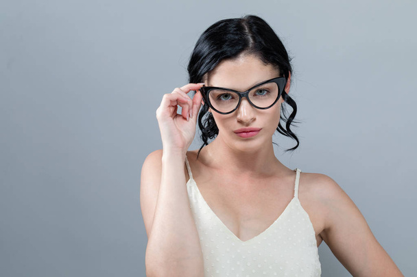 Young woman with eye glasses - Fotó, kép