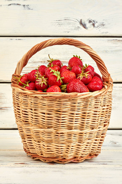 Wicker basket full of ripe strawberries. - Photo, Image