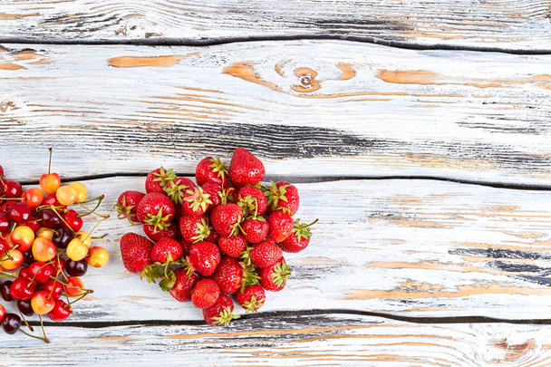 Sweet organic berries on wooden background. - Photo, Image