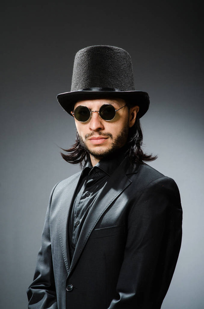 Vintage concept with man wearing black top hat - Fotó, kép