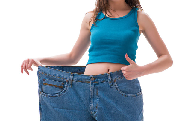 Concept of dieting with oversized jeans - 写真・画像