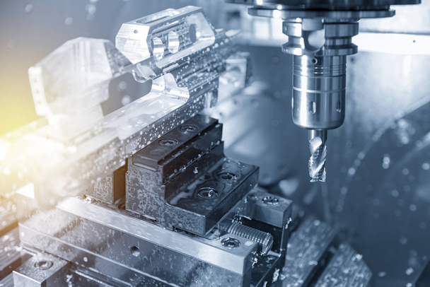 The 5-axis CNC milling machine cutting aluminium  automotive part.The Hi-Technology manufacturing process. - Photo, Image