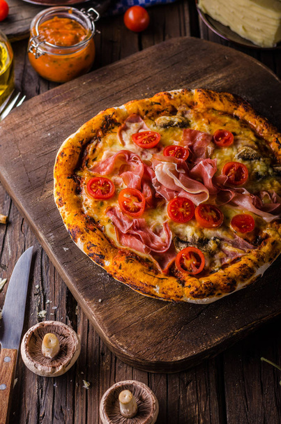Rustic old style vintage pizza, wood board, fresh food - Фото, зображення