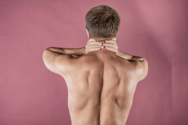 Man holding his neck trying to relieve pain - Foto, immagini