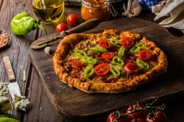 Rustic old style vintage pizza, wood board, fresh food - Foto, imagen
