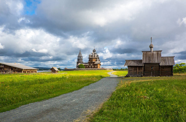 Russia, Karelia region, Kishi island, the Trasfiguration and Assumption  wooden churchs seen from the village - Foto, afbeelding