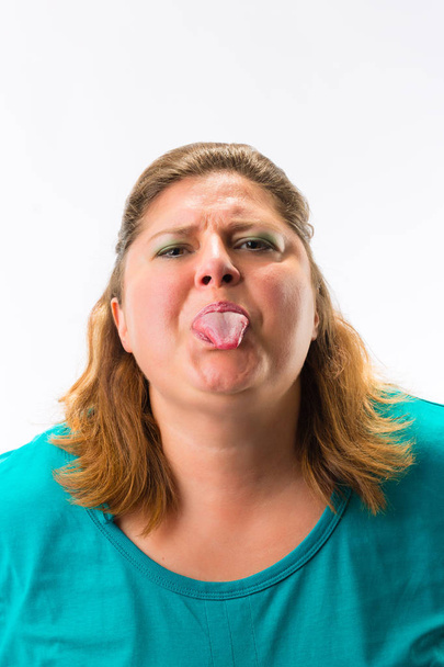 Крупним планом жінка показує язик
 - Фото, зображення
