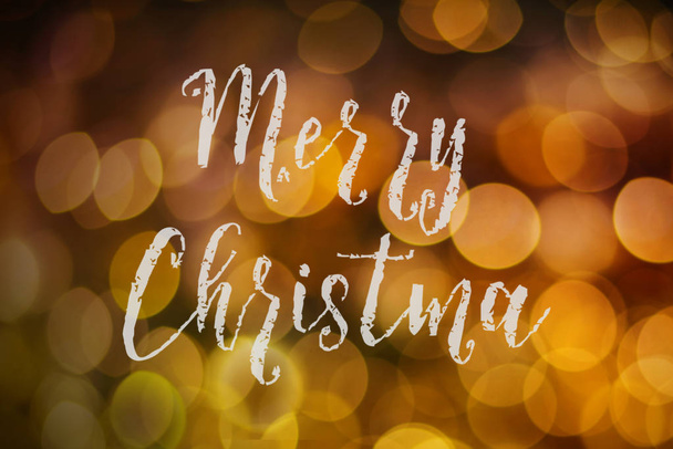 Merry Christmas and New Year typographical on pink gold sparkle bokeh or defocus  with Xmas card text. - Fotó, kép