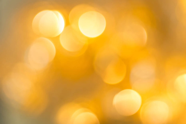 The golden bokeh abstract image for background. - Foto, Bild