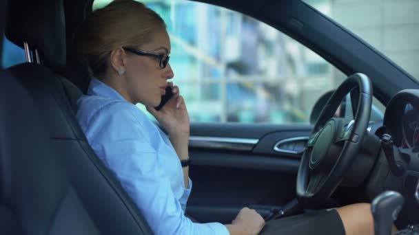 Businesswoman scolding colleague via phone, conflict at work, stressful day - Felvétel, videó