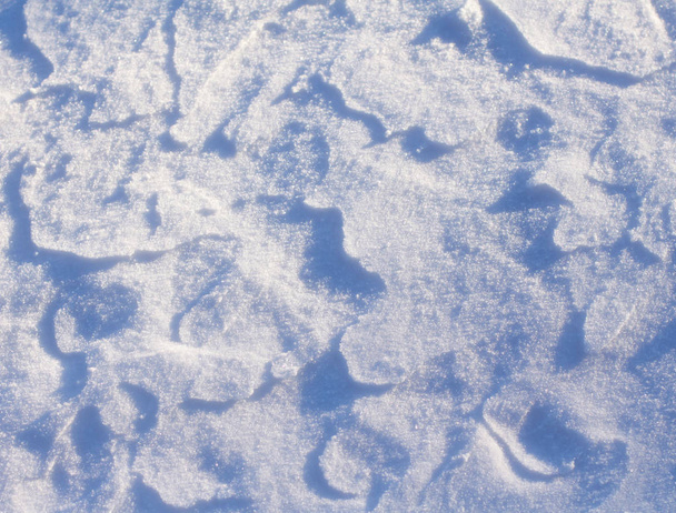 Shapes and patterns fromed by the sun and the snow - nature's contemporary painting - Photo, Image