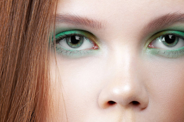 Eyes of young cute girl with colorful make-up close-up. Beauty and cosmetics - Φωτογραφία, εικόνα