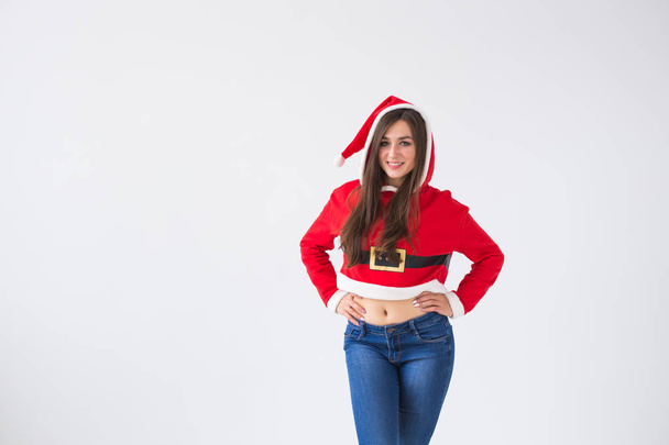 Holidays and people concept - Portrait of funny laughing woman in Santa Claus costume on white background with copy space. - Foto, imagen