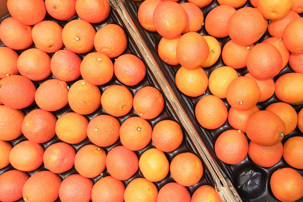 plody oranžové pozadí na trhu - Fotografie, Obrázek