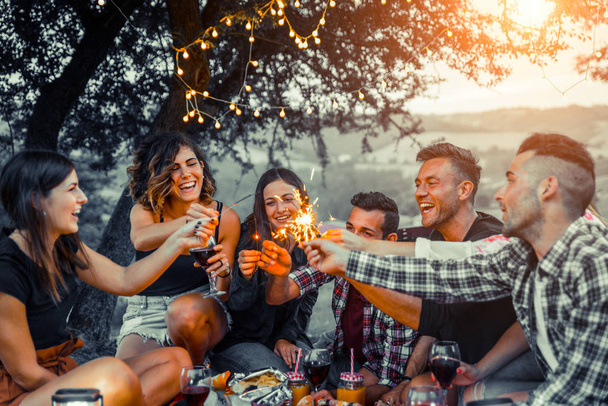Group of young happy friends having pic-nic outdoors - People having fun and celebrating while grilling ata barbacue party in a countryside - Fotoğraf, Görsel