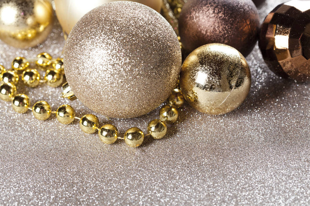 Christmas golden and brown decorations closeup on glitter background. - Foto, Bild