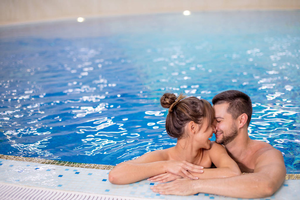Young couple having fun in the swimming pool .active lifestyle concept - Zdjęcie, obraz