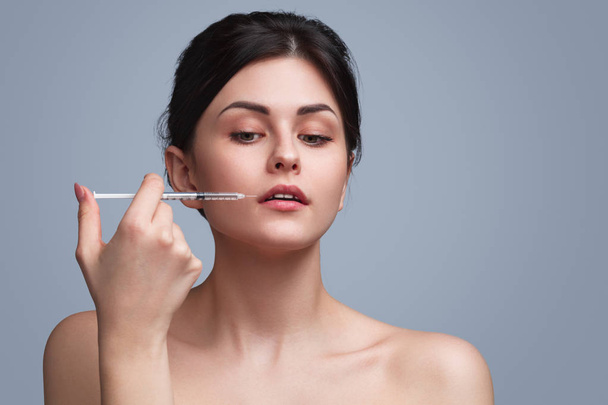 Sensual flawless model doing cosmetic injection - Zdjęcie, obraz