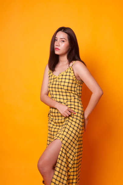Portrait of beautiful young Asian woman on yellow background - Fotoğraf, Görsel