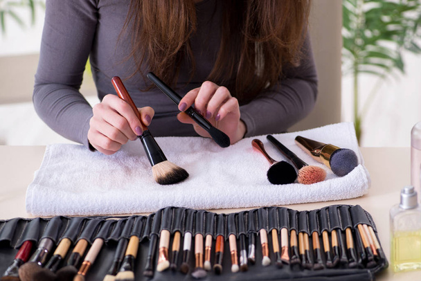 Make-up artist preparing brushes for work - Photo, image
